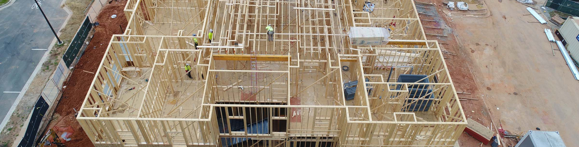 Blum Construction drone view of the wooden frame out of a building in process