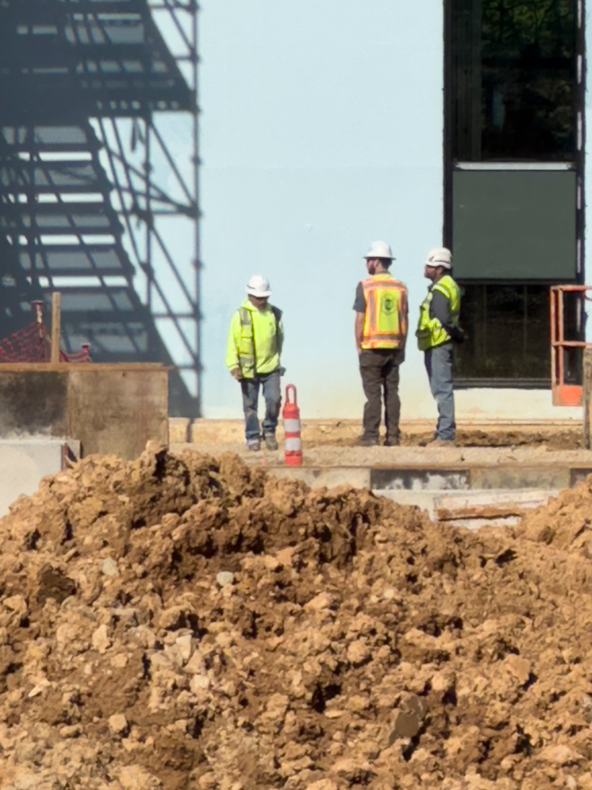 Blum Construction workers on a fresh foundation at a jobsite